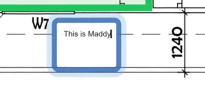 Typing a note under a traced bedroom with the Text tool